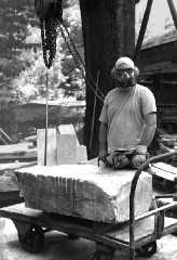 image of artist in working gear, link to artist biographical page,